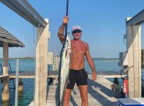 Tim McGraw, 53, shares shirtless photo with spearfishing catch: ‘What fish?’